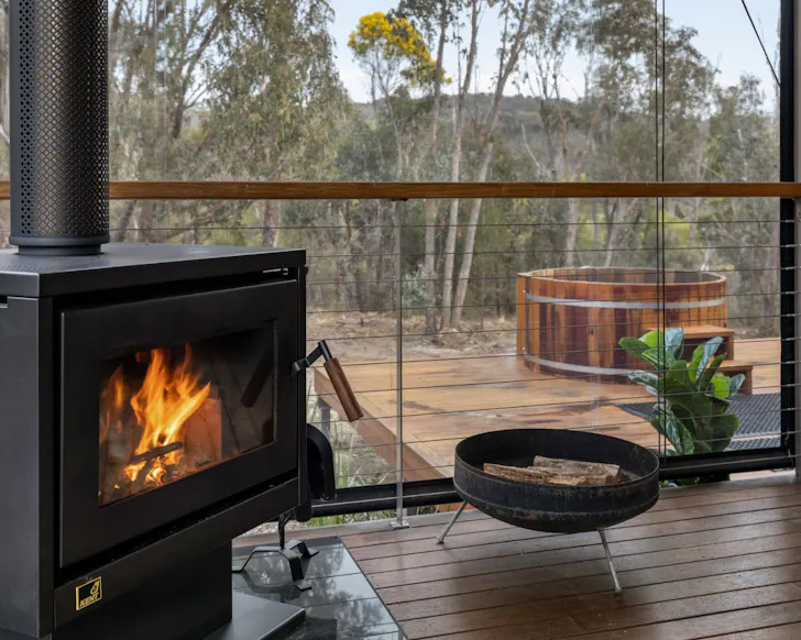 The wood burner and hot tub at Romancealot Cabin best accommodation Stanthorpe