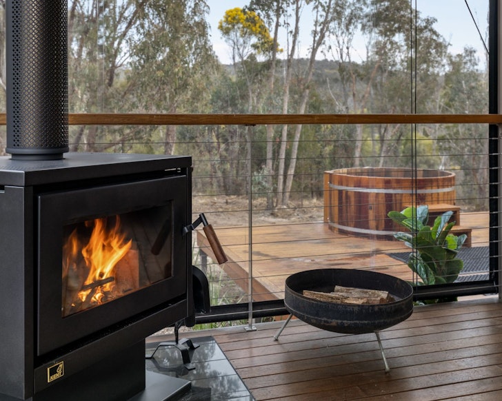 The wood burner and hot tub at Romancealot Cabin best accommodation Stanthorpe