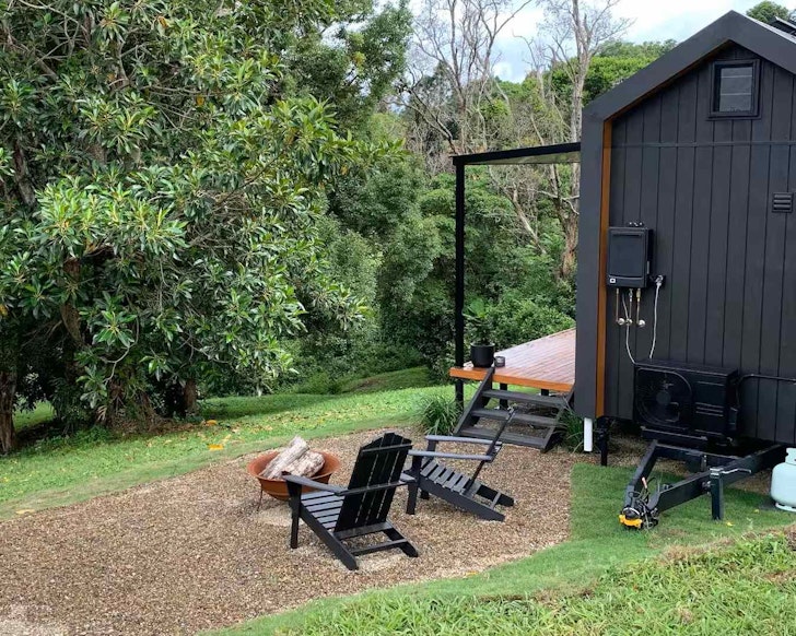 The eco tiny home with trees in the background in South East Queensland