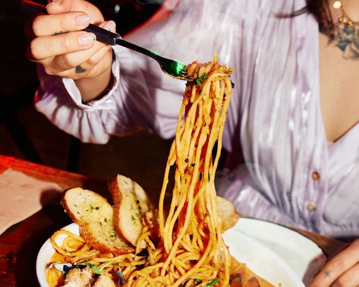 Forking a phat dish of rose pasta from Seoul Night, one of the best places to eat in Auckland on Monday night. 