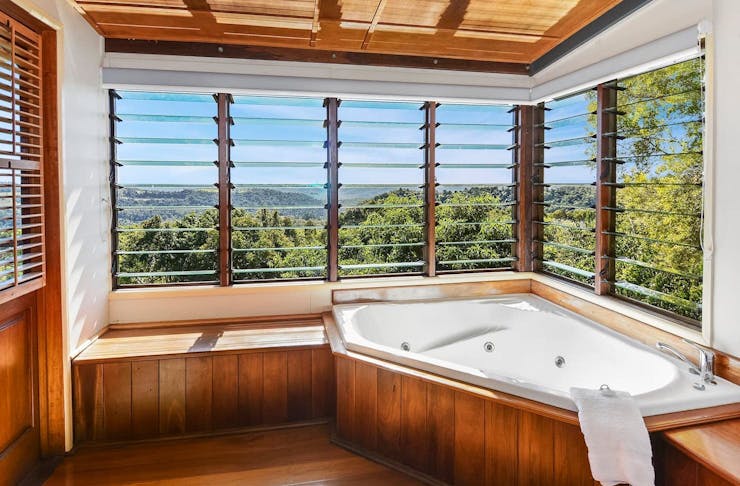 A spa bath overlooking the rainforest