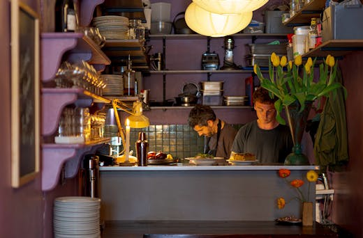 An intimate kitchen set up with the crew calmly doing the mahi at Roses Dining Room.