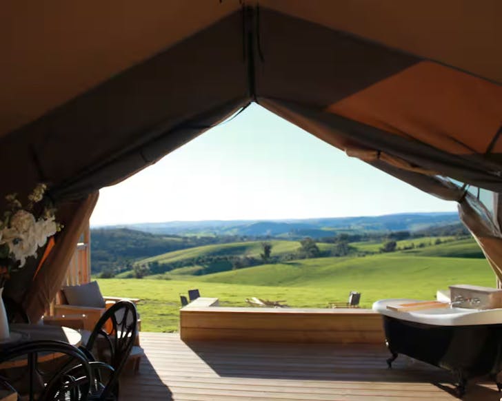 A view out of the tent at the outdoor bath at Rosewood Farmstay NSW