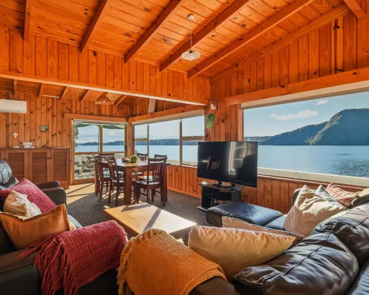 The cosy living space at Rotoiti Boathouse best lakefront Airbnbs NZ