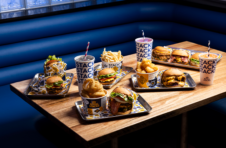 A table full of burgers, shakes, onions rings and chips at stellar joint serving some of the best burgers Melbourne has on offer