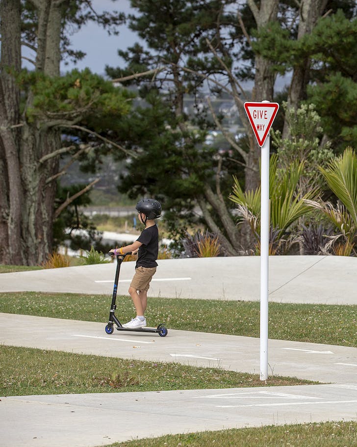 A small person on a scooter in Royal Reserve.