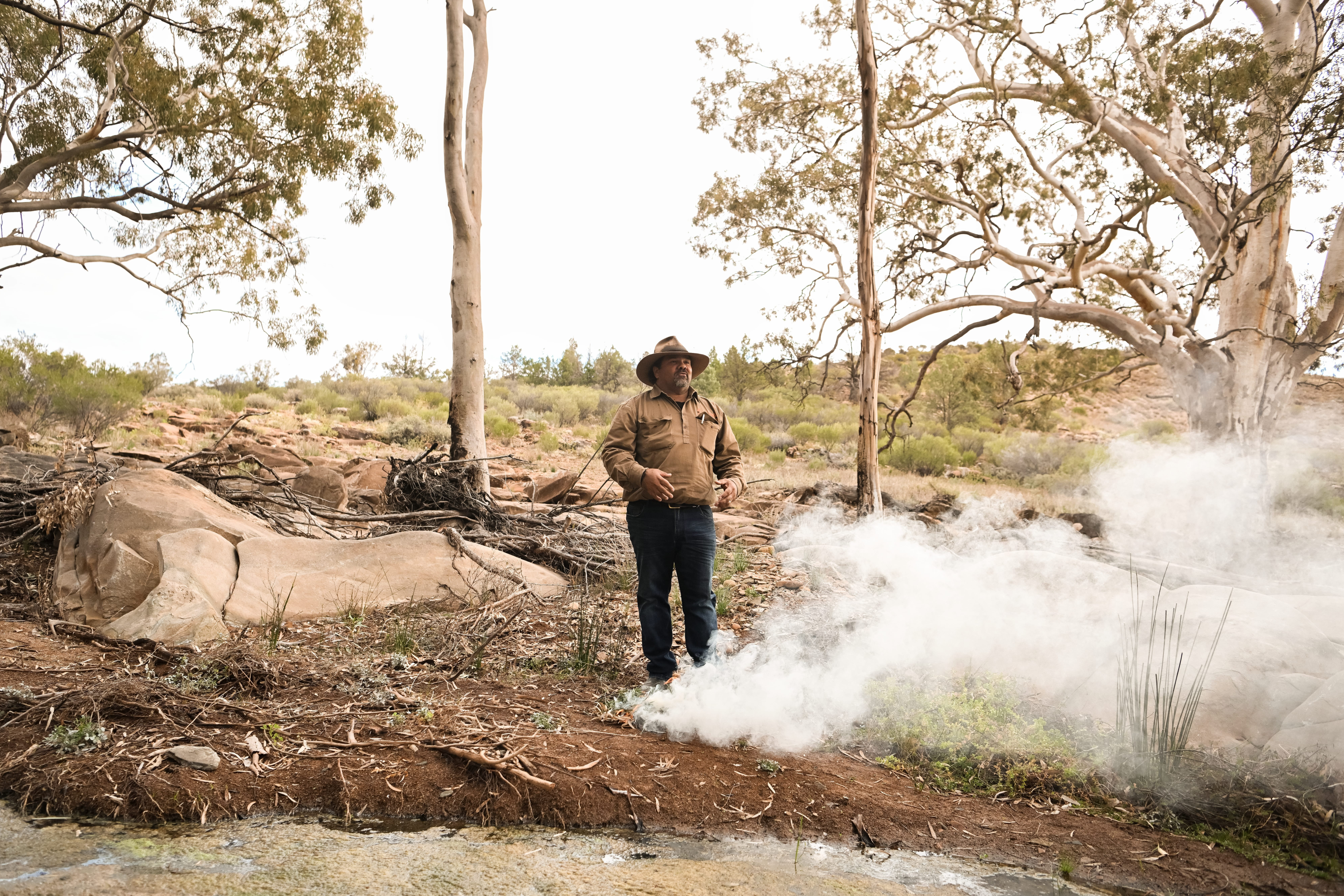 Man doing an Aboriginal smoking ceremony.