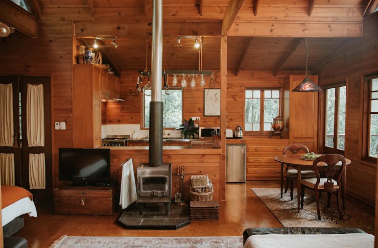 a wooden cabin with fireplace