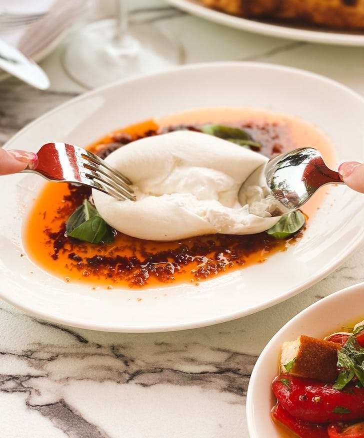 a plate of burrata at a sunshine coast italian restaurant