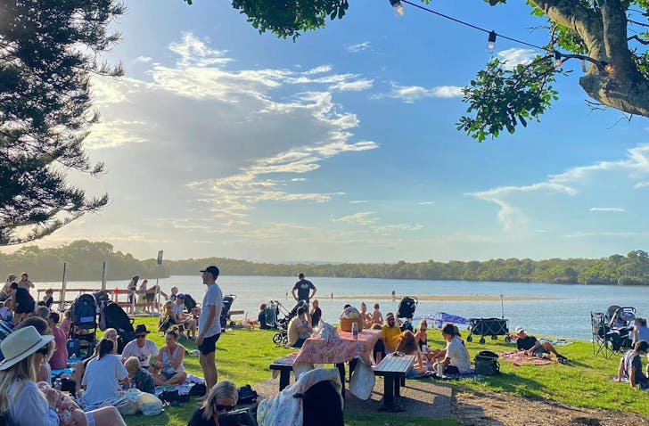 people at a lakeside market