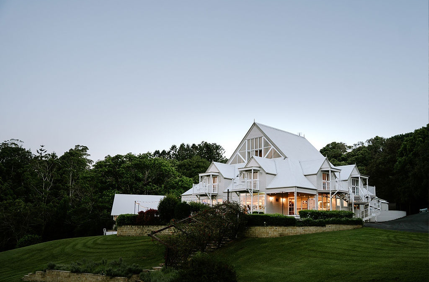 a white wedding chapel with landscaped gardens