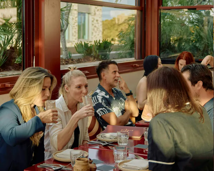 People at a table chatting