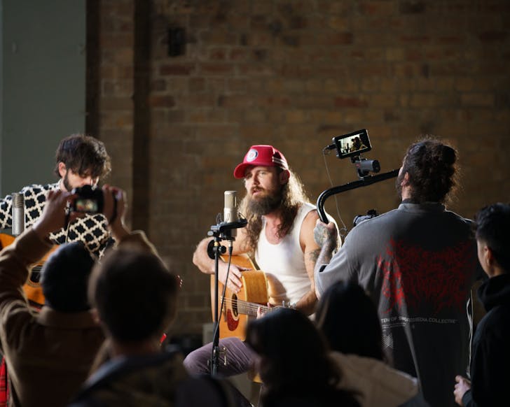 Person singing and being filmed