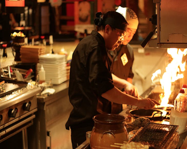 A chef cooks up a storm at Sakebar Nippon. 