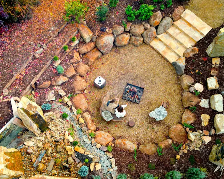 Guests at the fire pit at Samadhi one of the best health and wellness retreats Australia