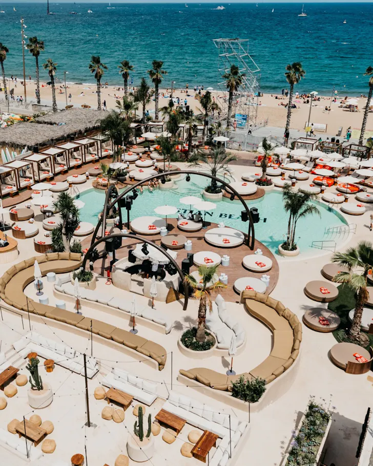 An overhead shot of Bastian Beach Club on the shores of San Sebastia Beach, Barcelona.