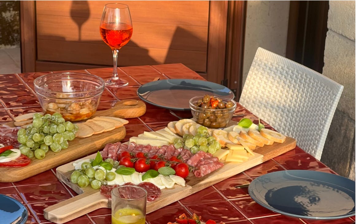 Outdoor table with food and cocktails