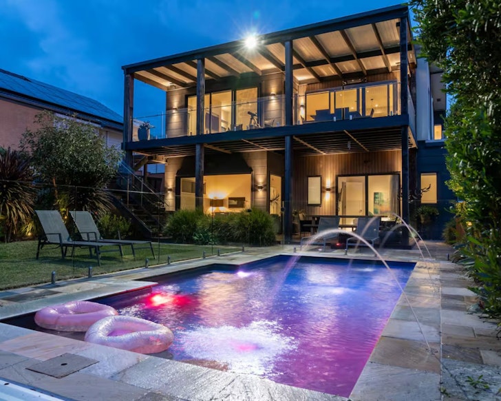 A view of the house from the pool at Sandpiper House one of the best kid-friendly Airbnbs in Australia