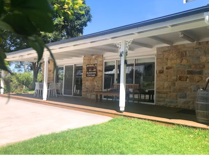 An external view of Sandstone Cottage Airbnb one of the best accommodation options in Narooma, NSW