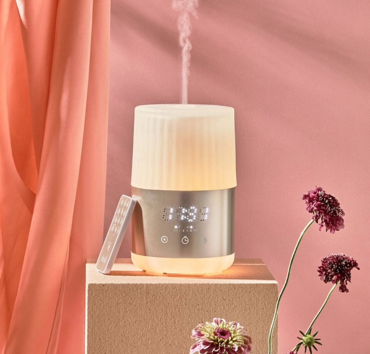 Essential Oil Diffuser Alarm Clock sitting on a bench