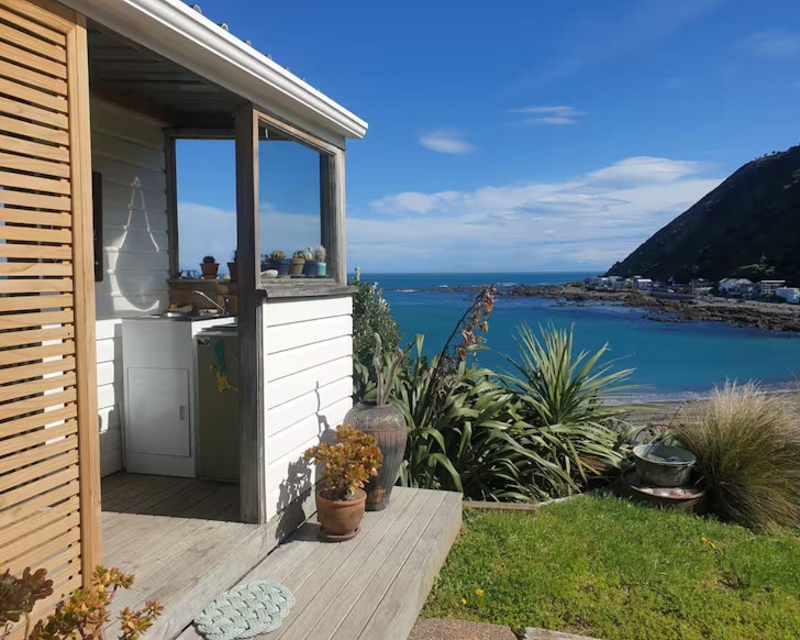 A view across the water from Seaside Retreat one of the best beach house Airbnbs NZ