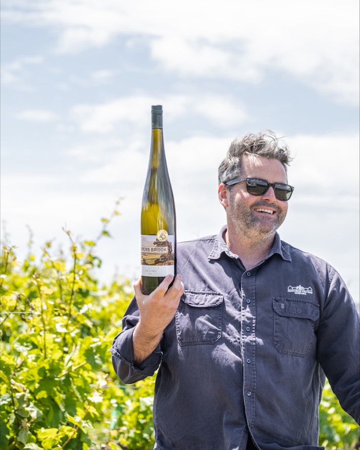 A man raising a wine