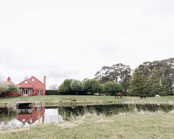 A view of the red exterior of Sedalia Farm Cottage Airbnb one of the best stays in the Southern Highlands NSW
