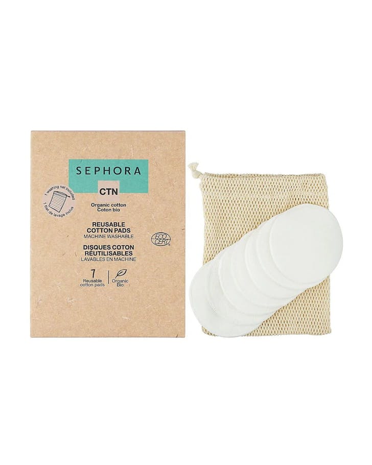 7 reusable cotton pads with a brown mesh drawstring bag and a brown paper box.