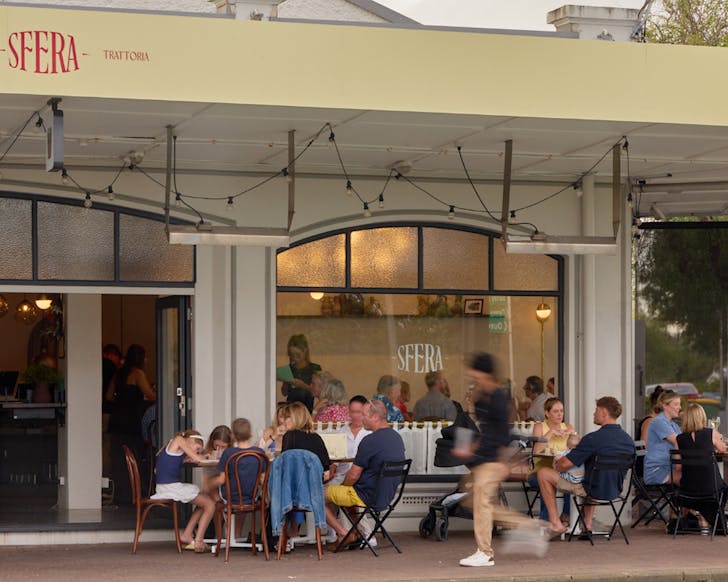 Packed tables outside new Italian restaurant, Sfera. 