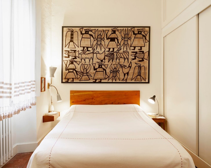 The bedroom with art at Shades of Clay best Milan Airbnbs