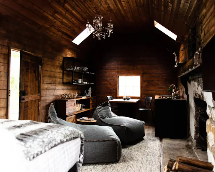 The wood panelled interior of the Shearer's Hut one of the best tiny homes in Tasmania