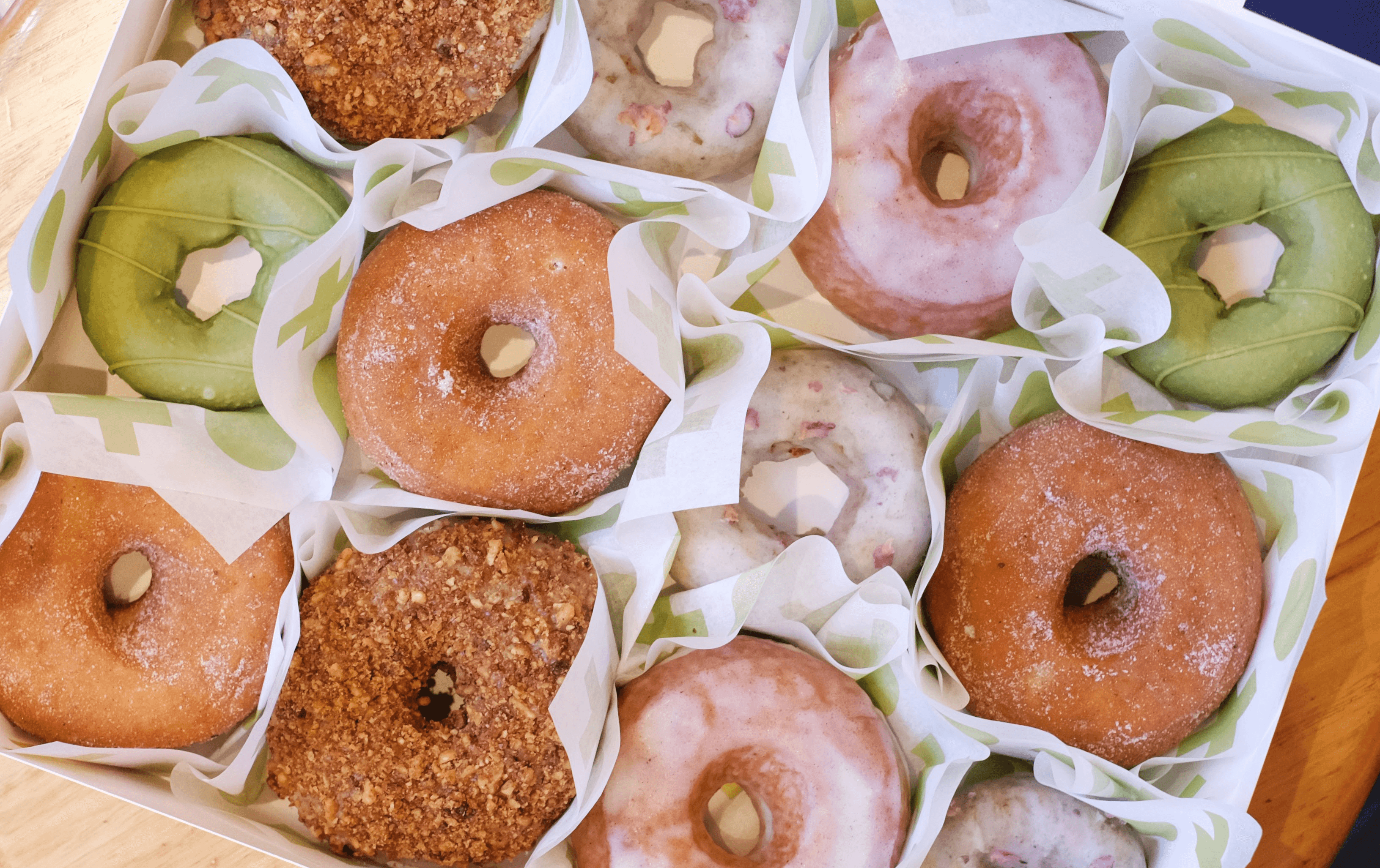 A white box filled with different coloured donuts, some of the best donuts Melbourne. 