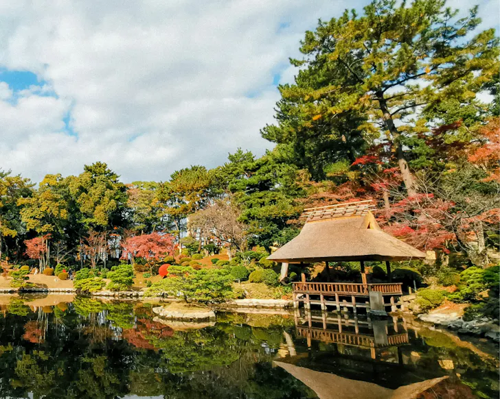 The stunning, autumn-coloured garden and pond in Hiroshima. 