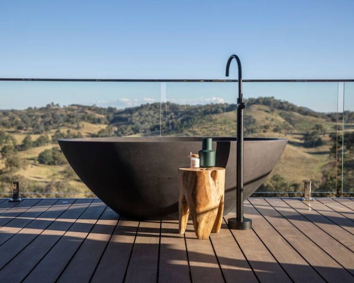 The outdoor bath overlooking the hills at Sierra Escape Airbnb NSW