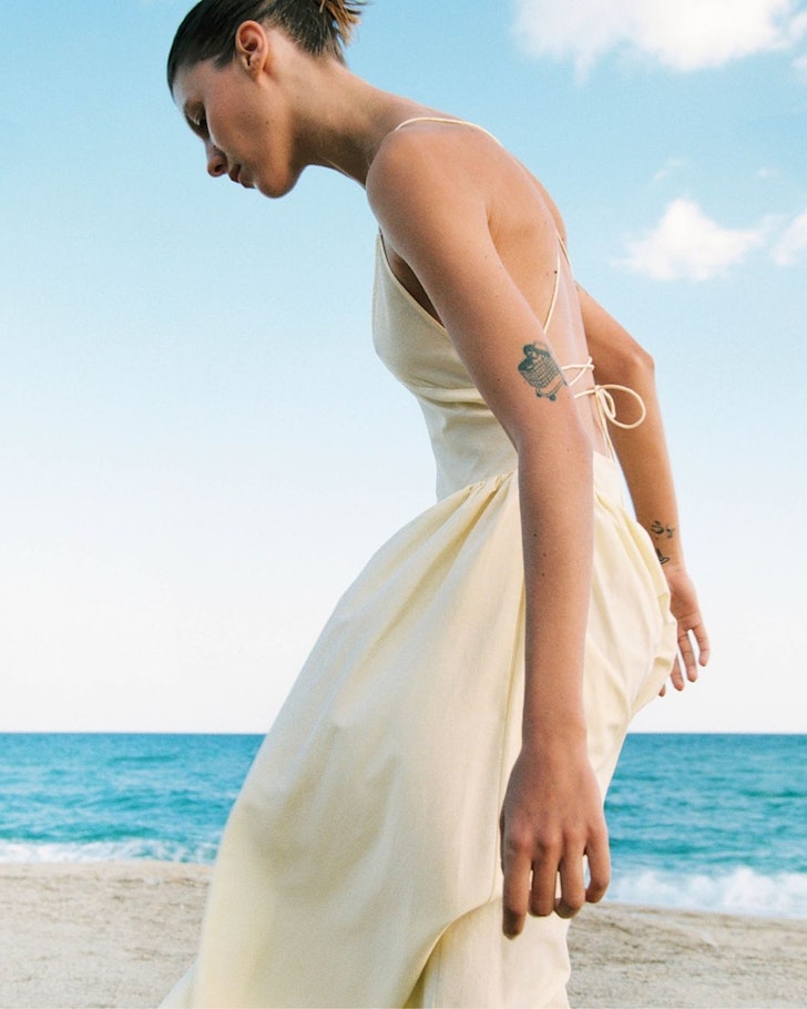 A model wears a strappy sundress from Silk Laundry one of the best Australian fashion labels