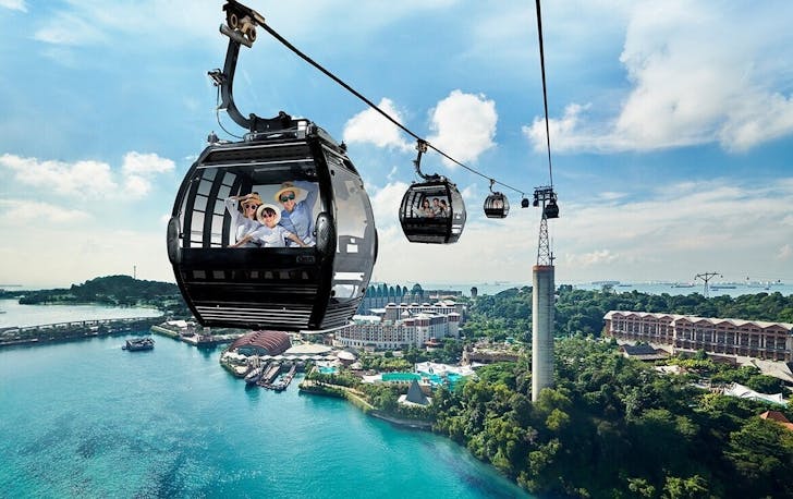 A family riding the Singapore Cable Car