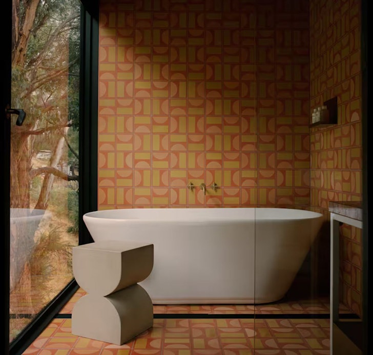 The retro orange tiled bathroom at Slow Beam one of the best Airbnbs in Hobart
