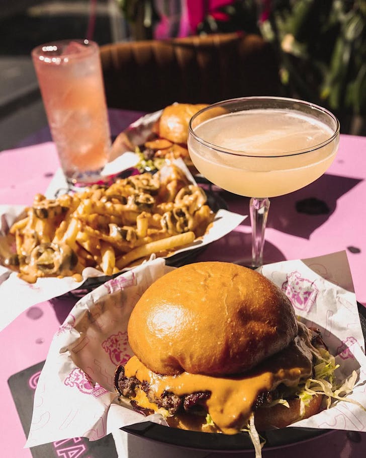 Two smashed burgers, loaded fries and drinks from Smashed Puku's, one of the best restaurants in Wynyard Quarter. 