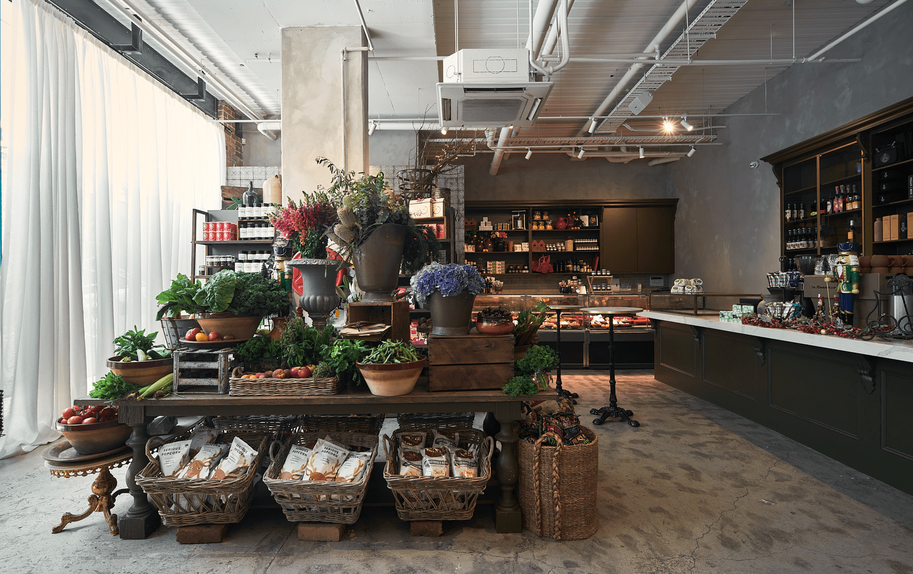 A grocery section of food and produce inside a contender for the best vegetarian restaurant in Melbourne.