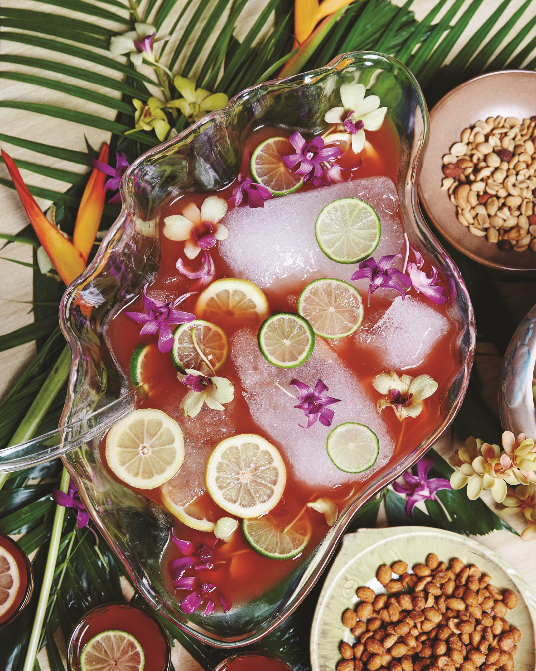 Beautiful red punch with lime and flowers with nibbles on the side