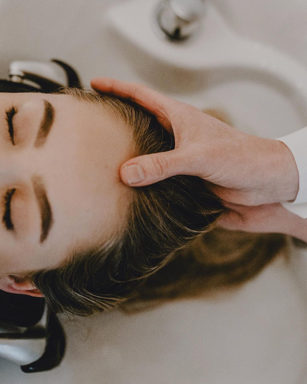 a woman getting a head spa at brisbane salon atama