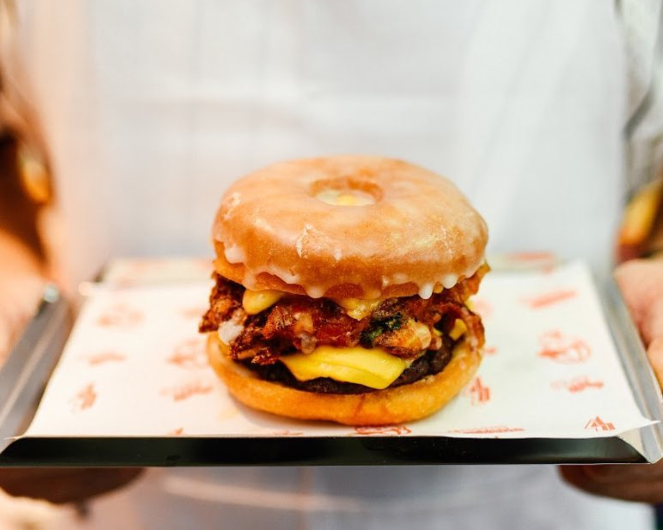 A glazed doughnut burger stuffed with a beef pattie, melted cheese and more.