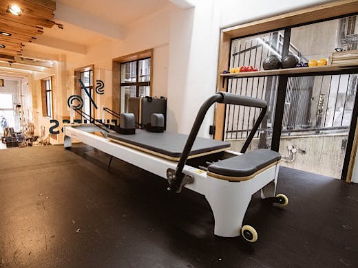 A reformer pilates machine in all its glory. 