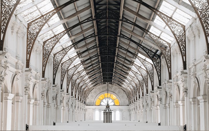 A big white hall with high ceilings. 