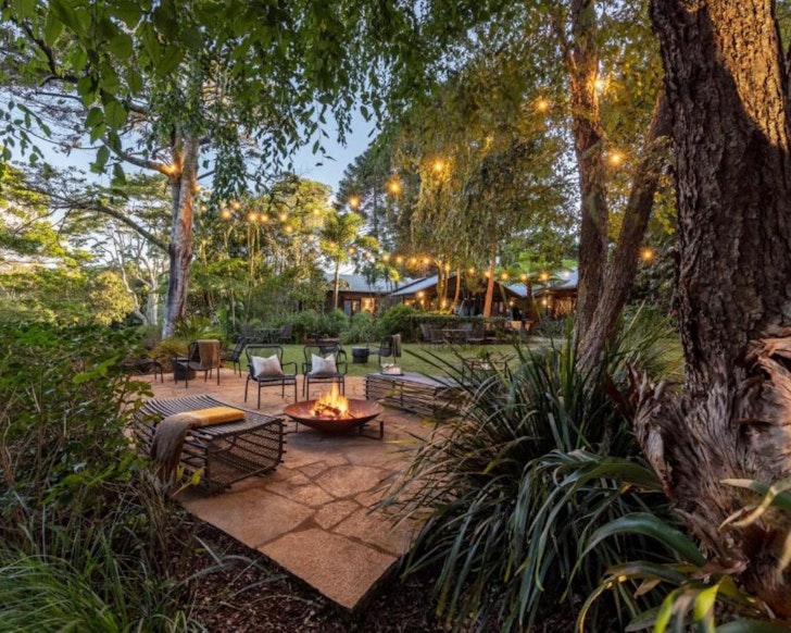 A fire pit burns outside Spicers Tamarind Retreat one of the best accommodation options in Maleny