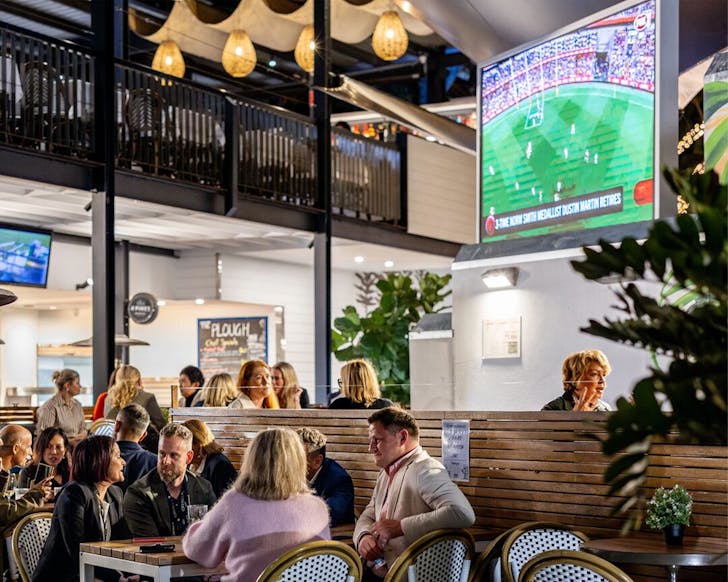 people sitting at a bar
