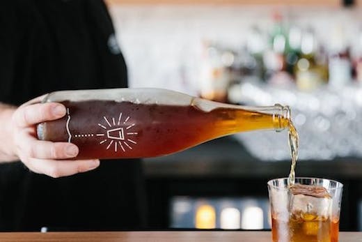 Drink being poured at St Brigid Bar