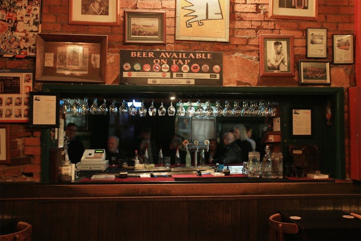 Wine glasses hang from the ceiling at a dog friendly pub in Melbourne