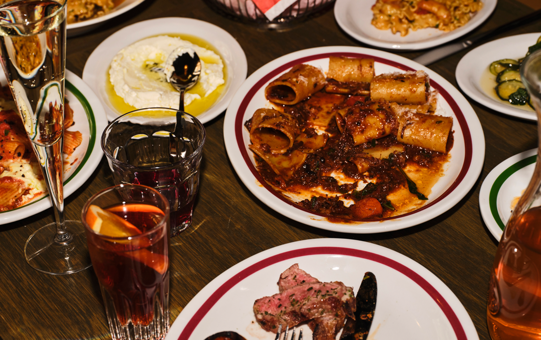 A table filled with different plates of food at a best Italian restaurant Melbourne