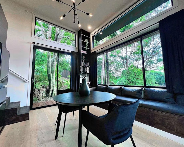 The sleek black interior of Studio Onyx one of the best Byron Bay Airbnbs